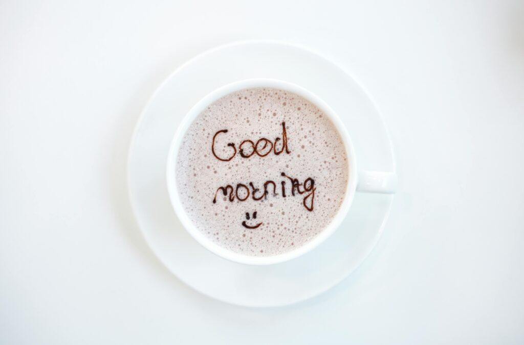 A cheerful hot coffee with 'Good Morning' written on top, perfect for starting the day.