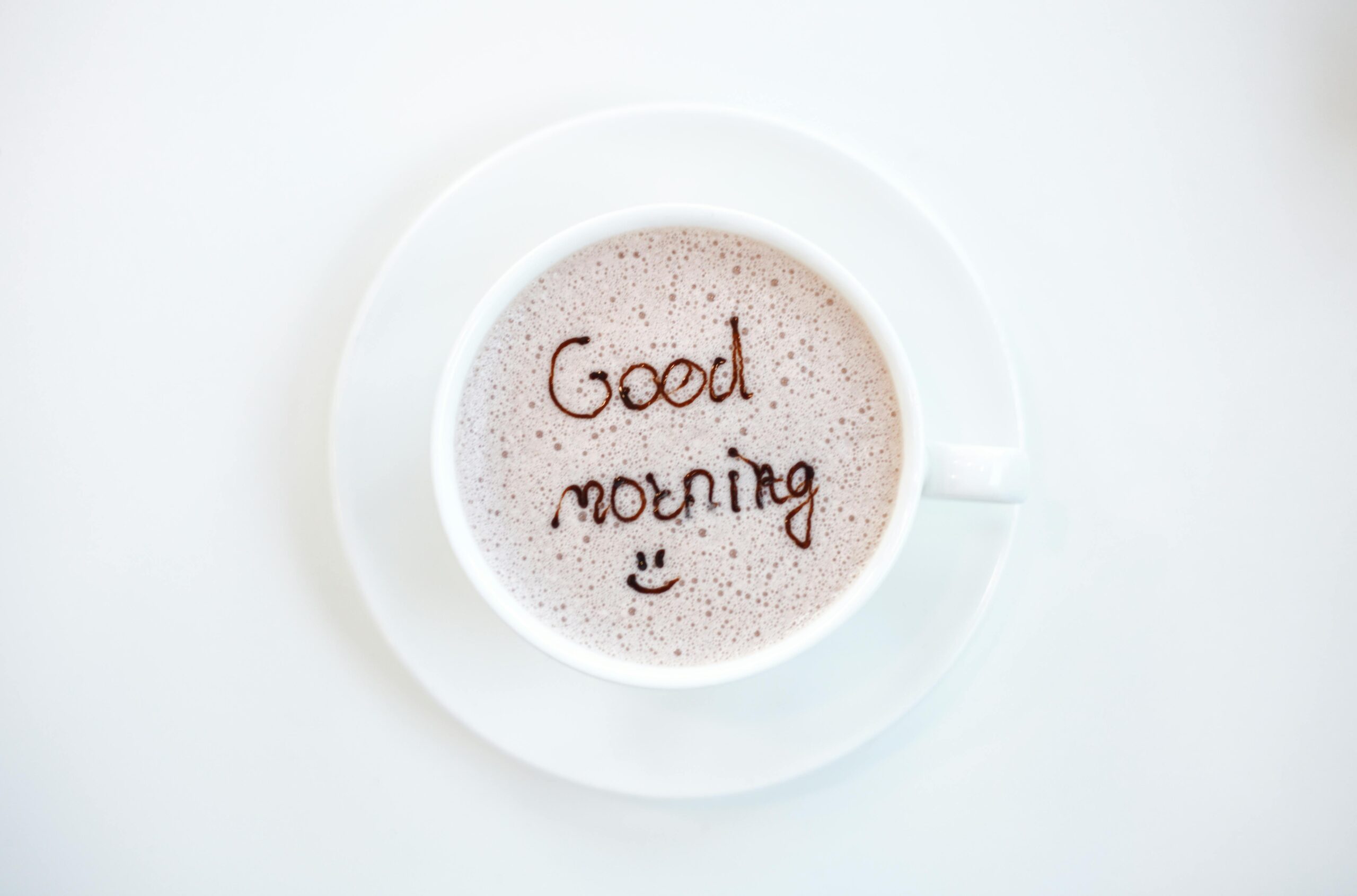 A cheerful hot coffee with 'Good Morning' written on top, perfect for starting the day.